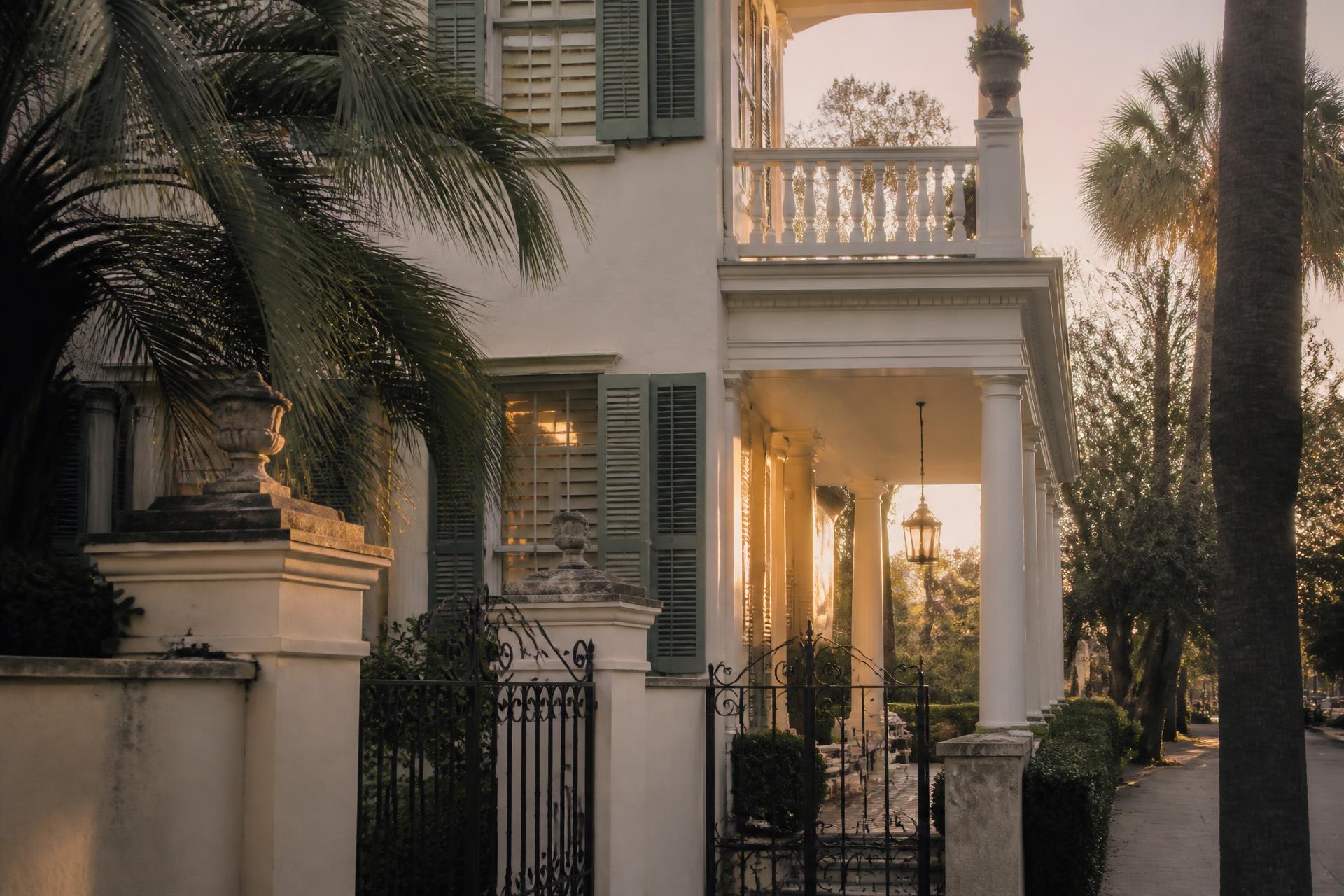 A Charleston single house piazza at dusk